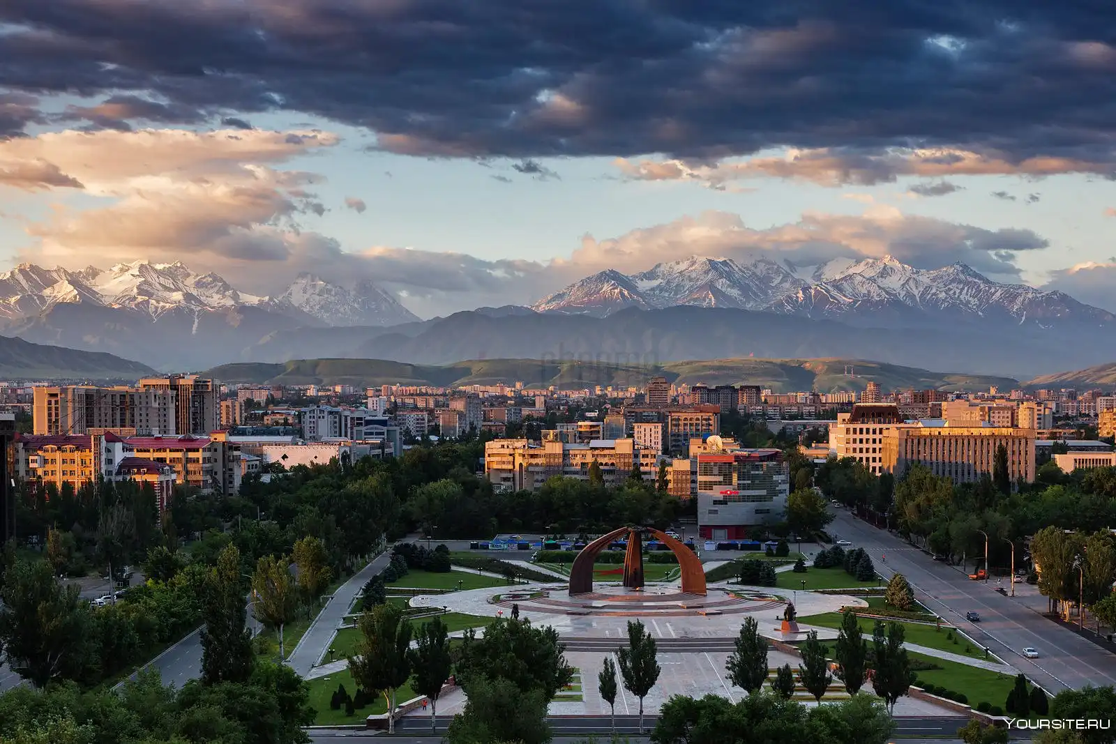 Street view of Bishkek city with Soviet-era architecture, green parks, and local daily life