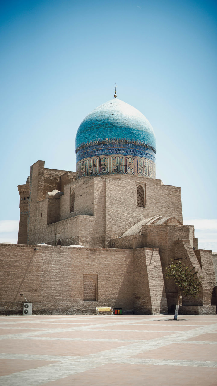 Travelers enjoying the beauty and culture of Bukhara.