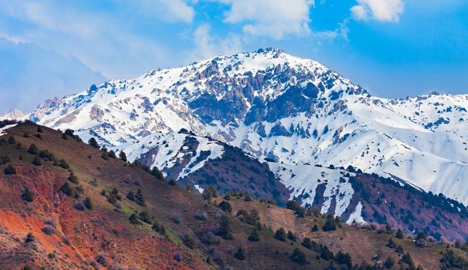 Snow-capped peaks of Chimgan Mountains during winter season.