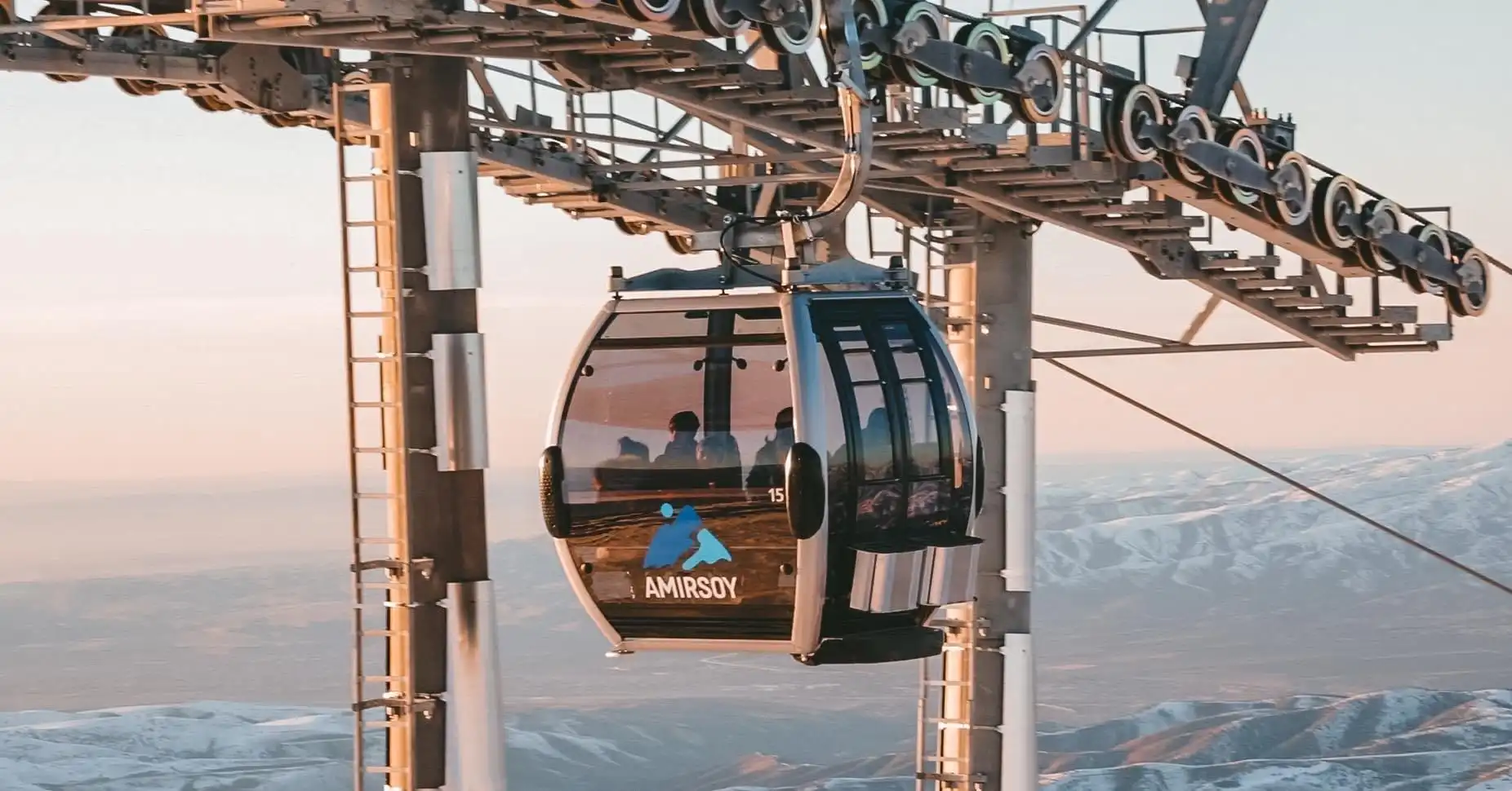 Sunrise over Chimgan peaks with clear blue sky.