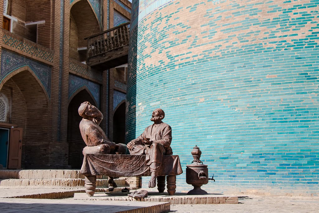 Silk Road sculptures and Isfandiyar Palace stop on Khiva tour