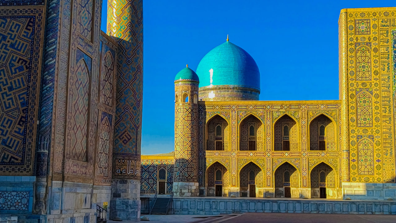 Local women walking through Shah-i-Zinda corridor in Samarkand.