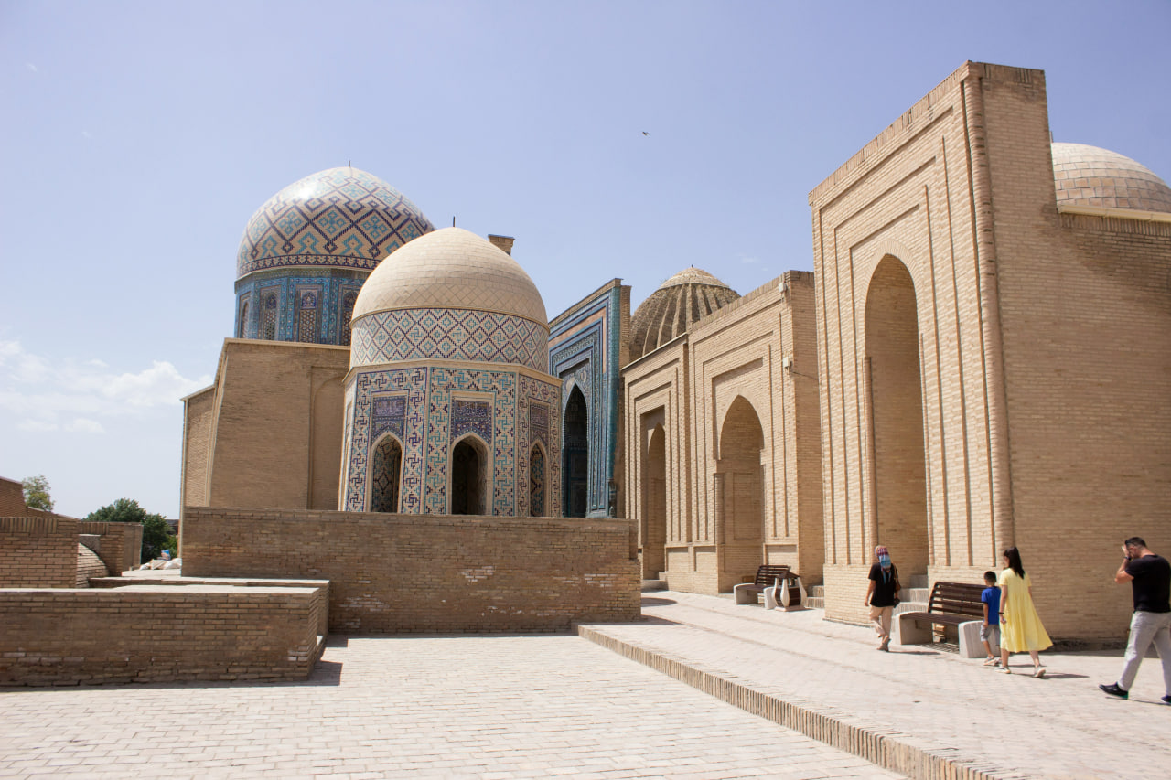 PathoraTrip travelers exploring Registan Square in Samarkand.