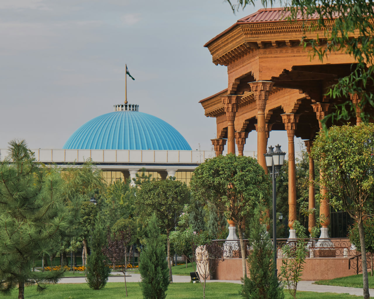 Broad Avenue in downtown Tashkent surrounded by trees and cafes.