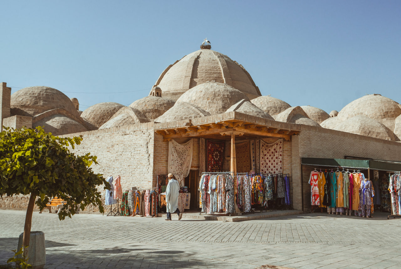 Explore ancient Bukhara market with souvenirs on private tour